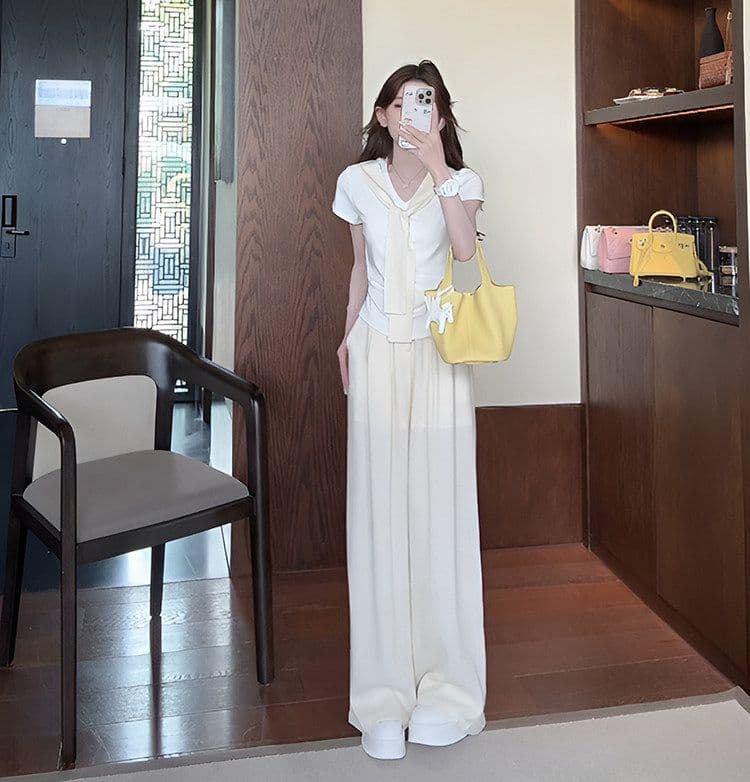 여름 새로운 미니멀리즘 패션 세트 디자인 Chic 페이크 레이어드 맨위 짧은 티셔츠 와이드 레그 팬츠 투피스 세트 상세 이미지 11