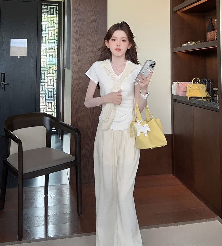 여름 새로운 미니멀리즘 패션 세트 디자인 Chic 페이크 레이어드 맨위 짧은 티셔츠 와이드 레그 팬츠 투피스 세트 상세 이미지 12