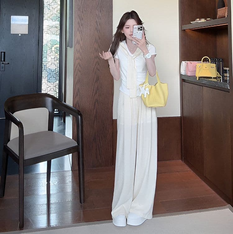 여름 새로운 미니멀리즘 패션 세트 디자인 Chic 페이크 레이어드 맨위 짧은 티셔츠 와이드 레그 팬츠 투피스 세트 상세 이미지 14