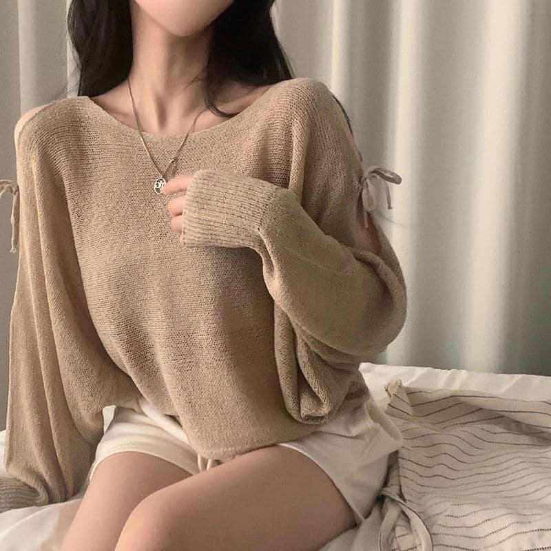 여름 프랑스식 디자인 센스 홀로우 아웃 스트랩 나비 매듭 루즈핏 긴팔 자외선 차단 니트 블라우스