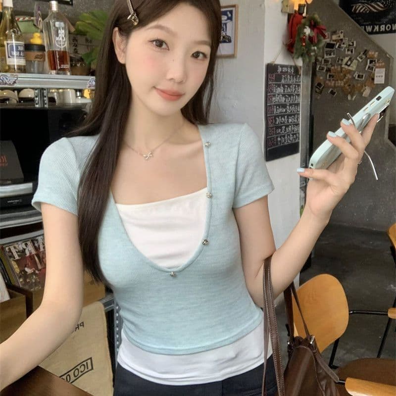 원본 광저우 원단 페이크 레이어드 패치워크 색상 긍정적 인 어깨 반팔 티셔츠 여성 여름 2026 새로운
