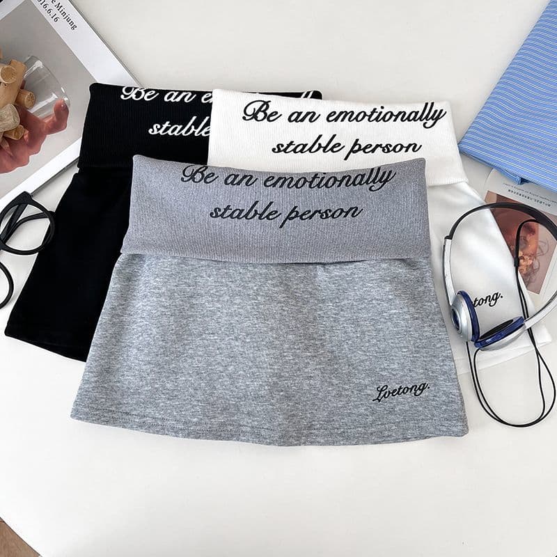 순수한 Mianhua 면 복합 우유 실크 패션 알파벳 프린트 뒤집다 측면 하이웨이스트 반신 스커트 노출 방지 미니 스커트 여성 트렌디 상세 이미지 2