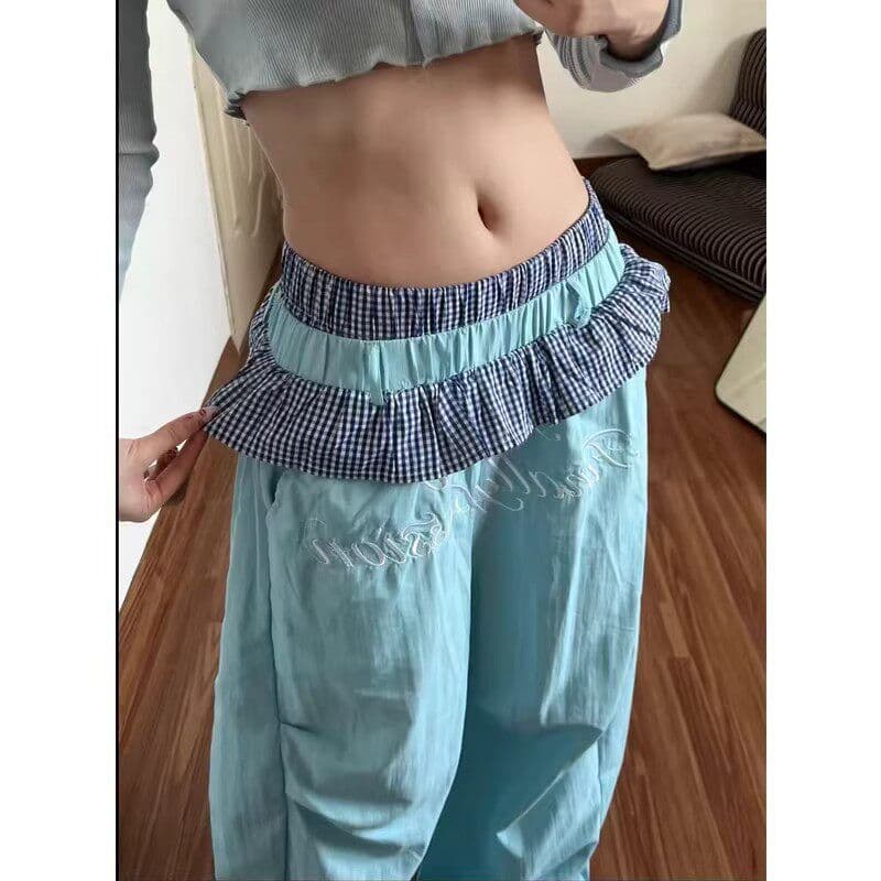 좋은 품질 아메리칸 핫걸 체크무늬 레이스 더블 허리 머리 패치워크 속도 건조한 모통이 칼 바지 도파민 색상 와이드 레그 팬츠 이미지 2